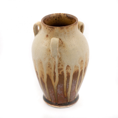 small three-handled vase with a shiny brown glaze on the lower half and a dripping matte white glaze dripping down from the neck