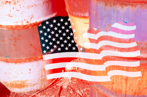 American flag super-imposed (montage) on close-up of three rusting 55 gallon drums.