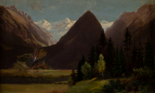 Valley scene with pinetrees, mountains in background and houses int he distance
