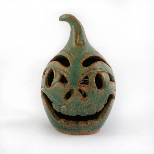 tiny green jack-o-lantern (face Jug) with tall stem