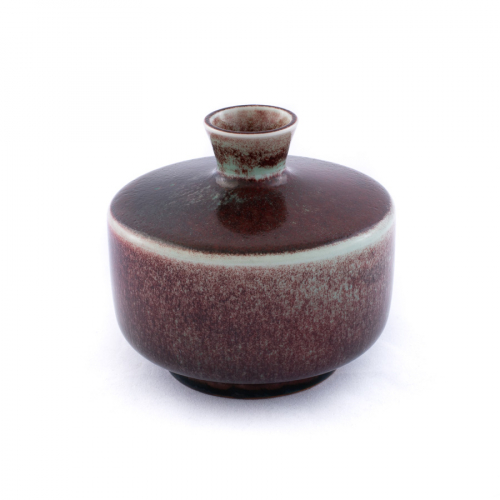 Short and stout bowl-shaped bottle with small neck; very dark with white trim around top of bottle and top of base