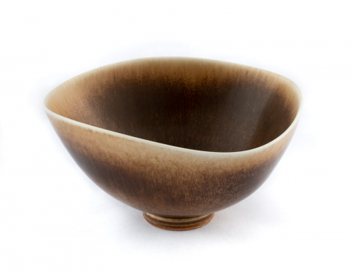 Tan, cream and brown bowl with a wavy rim