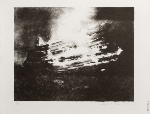 A nighttime image of burning fence or railroad ties.