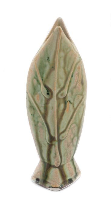  light green vase with darker drips running from top to bottom. resembles two leaves pressed together on a square base.