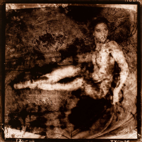 A highly distressed image of a seated nude female figure.