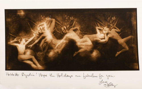 sepia-toned image featuring numerous nude male figures in a sequence horizontally. Artist note below about holidays.