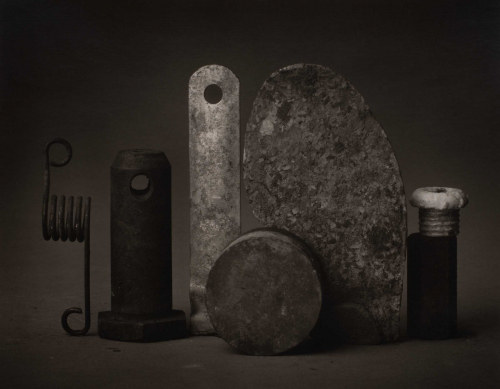 black and white still life of various stone/metal objects