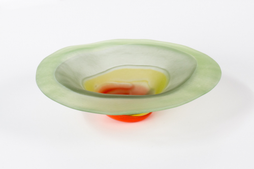 Wide-brimmed bowl, primarily light green but with a red bowl at the foot. 