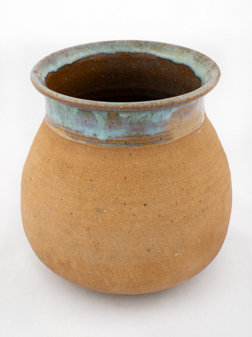 A pot, or jar, unglazed except for a light green on the neck and rim. A thinner green glaze is in the interior.
