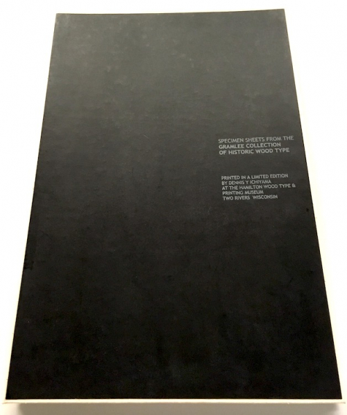 Black clamshell box of prints