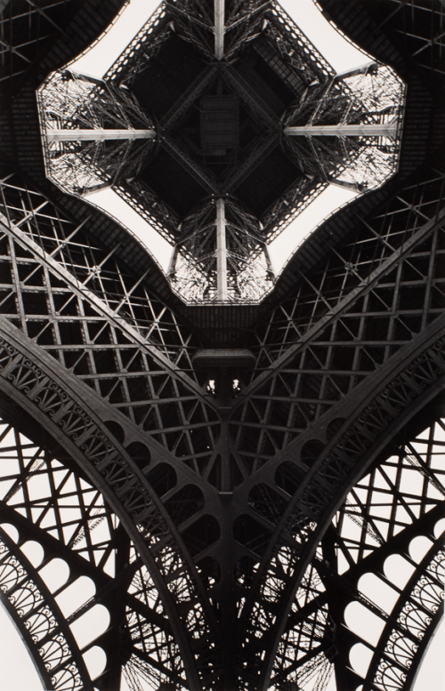 View from underneath a metal structure (Eiffel Tower). 