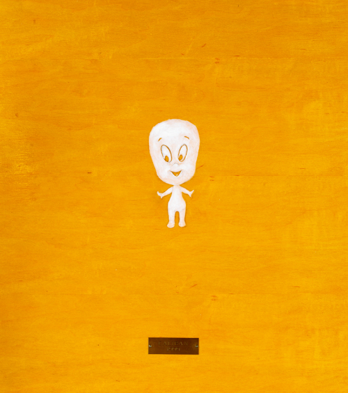 Depiction of a tiny "Casper the Friendly Ghost" cartoon figure on an orange varnished, but otherwise unadorned, plywood board."