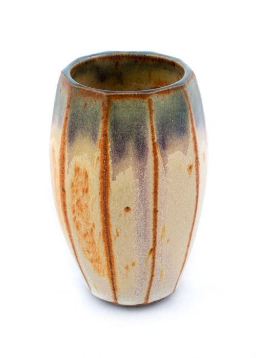 An eight-sided narrow vase with a shino glaze, which turns orange at edges, and has a bluish upper section.