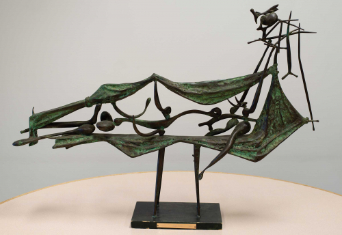 Bronze open horizonal sculpture balanced on four legs