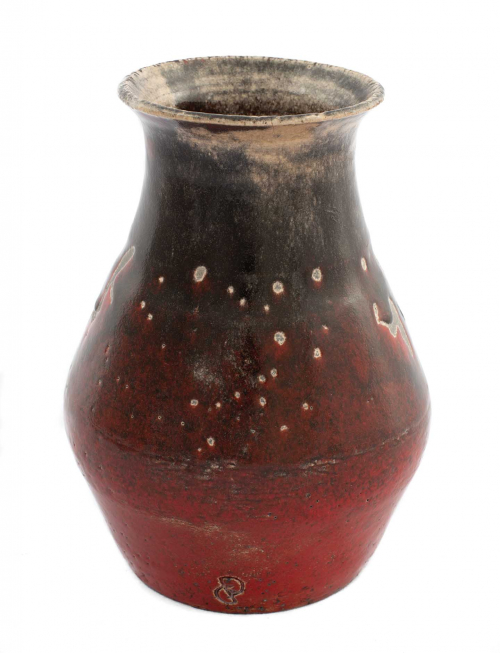 vase form with a wide rim and a pitted glazing in reds, blacks, and beiges