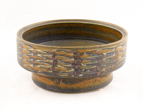 Large, dark bowl with horizontal markings on the side