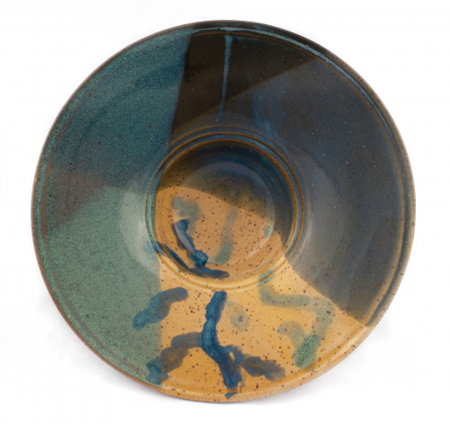 wide rimmed bowl with shiny glaze - rectangles of blue, brown, and beige - and brush marks in one quadrant