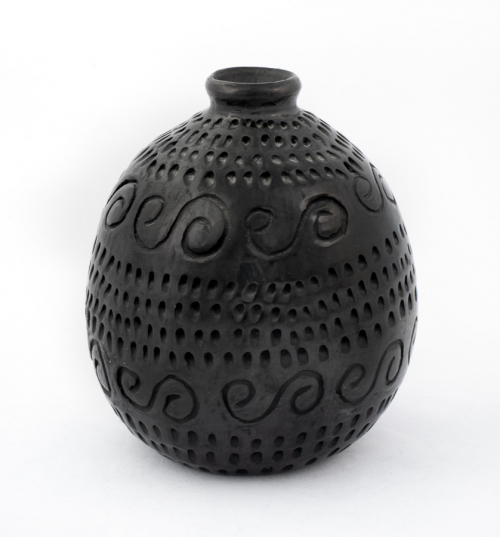 A small, narrow mouthed, ovoid-shaped vase with numerous dot indentations