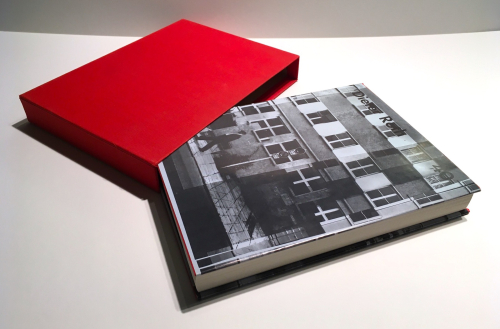 A book with a red cloth clamshell box