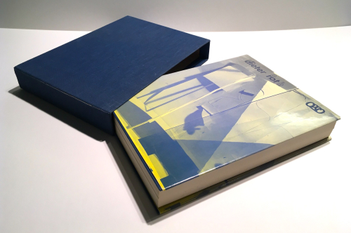 A book with a blue cloth clamshell box