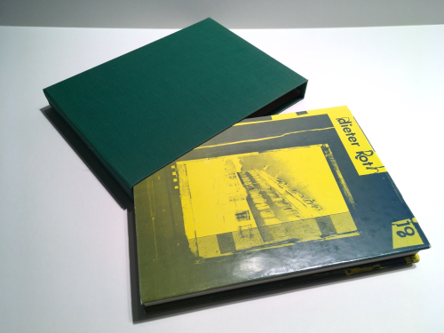 A book with green cloth clamshell box