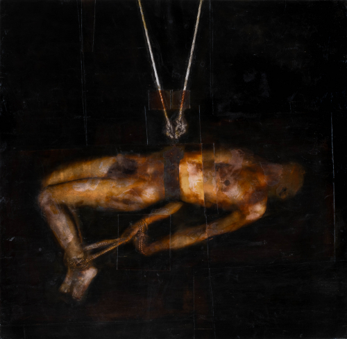 a man being hung with bound feet and hands; body is suspended horizontally by ropes around his waist in a dark toned background