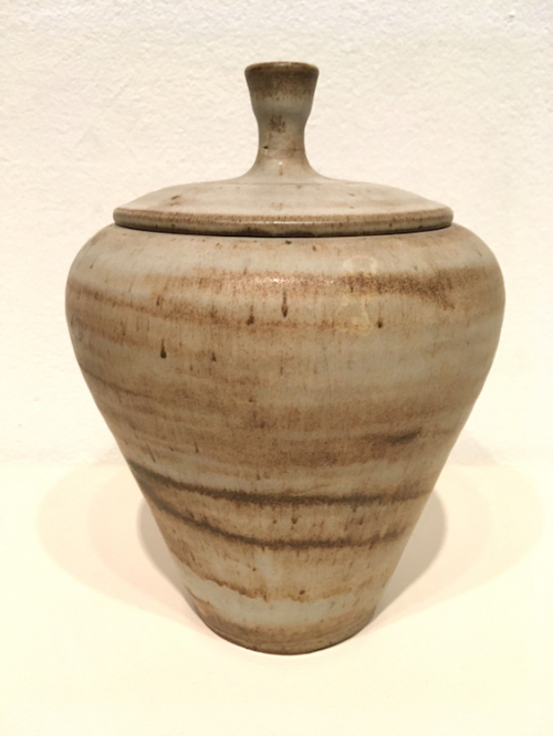 Light gray and ochre strawberry-shaped lidded pot