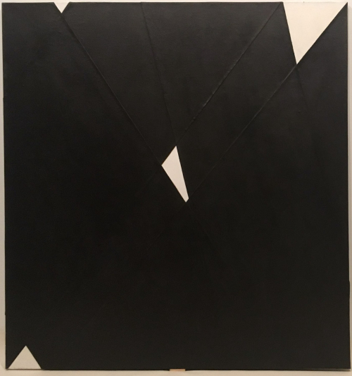 A large black and white painting with strips of sewn canvas