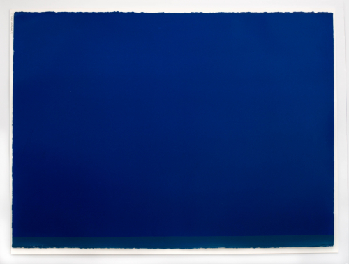 Majority of print dark blue with a grey-blue strip on bottom.