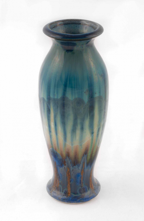 slender vase form with vertical and flame-shaped glazes in blues, greens, whites, and brown