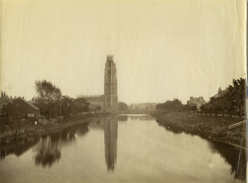 Church and river are in front of tower reflection