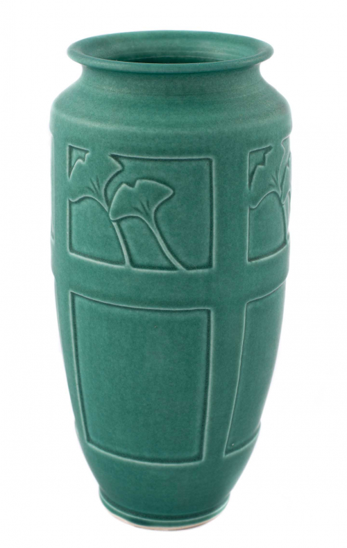 green vase, possibly a mass-produced, with rectilinear impressions and the outlines of gingko leaves.