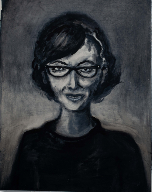 Black and white portrait of a woman with flipped-out hair and cat-eye glasses