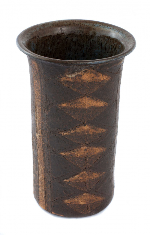 Brown and ochre tall pot with diamond designs on the sides