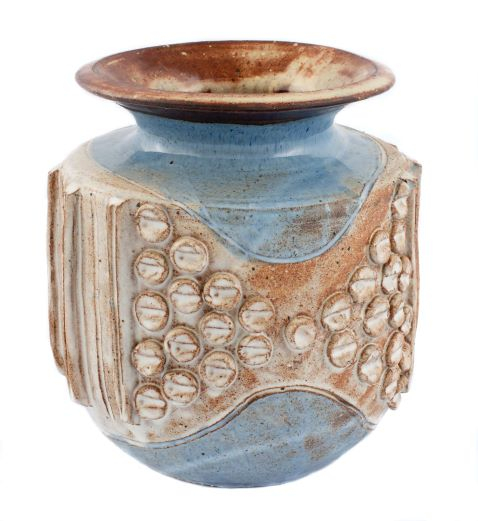 Blue and brown pot with numerous disc-shapes on the body